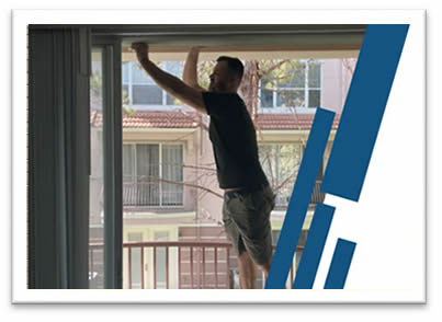Sliding Door track being repaired by a lanai paradise technician on a ladder